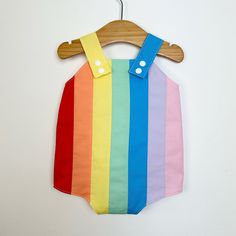 Baby retro rainbow romper. Poppers for easy changing, relaxed fit, plenty of room for nappies (cloth or disposable). Fully lined with light soft cotton. Seamless insides making them comfortable against babies skin. Rainbow design made up of carefully selected colours of 100% premium quality cotton. Adjustable length straps. Multicolor Bubble Romper For Summer Playtime, Multicolor Cotton Bubble Romper For Playtime, Multicolor Jumpsuits And Rompers For Summer Playwear, Playful Multicolor Bubble Romper For Playtime, Multicolor Cotton Onesie For Summer, Cute Multicolor Cotton Bubble Romper, Cute Multicolor Jumpsuits And Rompers For Playtime, Multicolor Jumpsuits And Rompers For Spring Playtime, Summer Multicolor Cotton Onesie