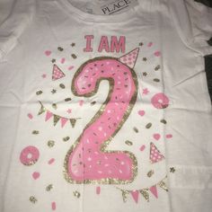 Nwt I Am 2 Years Old Birthday Shirt Sz 3t 3 Brand New With Tags From Tcp The Childrens Place Size 3t 3 Shirt Top Short Sleeves For The Birthday Girl Who Is Turning 2 Years Old Great Present For Her To Wear To Her Birthday Party Or Wear All Year Long To Remember Just Exactly How Old She Is Has The Number 2 Large On It With A Party Hat And Lots Of Confetti Reads I Am And Then The Year Old Number Glitter Gold Design Along With The Pink 2nd Birthday Have Mutiples Available Sisters Twins Triplets Pink Number Print T-shirt For Birthday, Cute Number Print Tops For Birthday, Pink Crew Neck Top For First Birthday, Pink Letter Print Top For Birthday, Cute Tops With Number Print For Birthday, Pink Crew Neck Top For Birthday, Cotton Tops For First Birthday, Pink Short Sleeve T-shirt With Number Print, Pink Tops With Letter Print For First Birthday