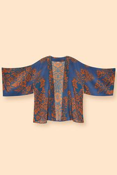 This kimono jacket is sure to be a Powderful favorite! With stunning details and gorgeous tones, our design has so many details you won’t be able to resist showing it off! Wear with jeans and a top for the ideal coverup. Comes with fabulous complimentary packaging. Go on, treat yourself! Sizing & Fit One Size Material 50% Viscose 50% Modal Casual Fall Cover-up With Kimono Sleeves, Fall Vacation Printed Cardigan, Summer Bell Sleeve Kimono, Oversized Bohemian Floral Print Outerwear, Oversized Bohemian Outerwear With Floral Print, Oversized Open Front Cover-up For Fall, Fall Floral Print Open Front Tops, Chic Fall Cover-up, Fall Festival Open Front Cover-up