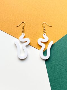 Calling all abstract lovers! Show your style with these acrylic laser-cut earrings! These earrings are the perfect accessories for your stylish outfit. -------------------------------------------------- * S I Z E S  &  M A T E R I A L S * - These earrings are roughly 7cm in length and 3cm in width. - This product is made of laser-cut acrylic plastic. It can come in a range of colours. Please refer to the primary colour options menu. - These earrings are available in either gold or silver plated White Artsy Earrings With Ear Wire, Artsy White Earrings With Ear Wire, Artsy White Drop Earrings, White Laser-cut Jewelry For Gifts, White Laser Cut Earrings As A Gift, White Laser Cut Earrings For Gift, Laser Cut Jewelry Acrylic, Laser Engraved Acrylic, Laser Cut Jewelry