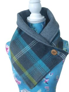 Feast your eyes on this elegant neck warmer! Handmade from a gorgeous wool touch tartan check fabric and lined with a plain grey fleece. Ready for those cold wintery days, this neck warmer is an excellent addition to a ladies wardrobe. Soft fleece lining on the neck gives this a chic warm look. It fastens with a coconut wooden button. Due to the colours this could be worn with creams, denims, blues, greys, lemons, blacks, etc, to give a classy and smart look. The scarf measures approx 39 inches Classy Scarf, Fleece Sewing Projects, Sewing Scarves, Fleece Projects, Crochet Neck Warmer, Neck Warmers, Check Scarf, Sewing Fleece, Fleece Scarf