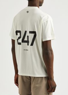 Find REPRESENT 247 Logo-print Stretch-jersey T-shirt on Editorialist. Info & Care Represent stretch-jersey T-shirt Ribbed crew-neck, dropped shoulders, logo print at front, printed back Slips on 82% polyester, 11% Lyocell, 7% elastane Machine wash; Size & Fit Length shoulder to hem: 28.5 inches/ 72.5cm Midweight Loose, boxy fit Model is 6'1'/ 185cm, chest size 38 inches and wears a size medium Sporty White T-shirt With Number Print, White Number Print Sports T-shirt, White Number Print Top For Streetwear, White Athleisure Jersey T-shirt, White Jersey T-shirt With Logo Print, Relaxed Fit Jersey T-shirt With Letter Print, Casual Jersey Tops With Number Print, White Graphic Print Jersey Tops, Athleisure Jersey T-shirt With Letter Print