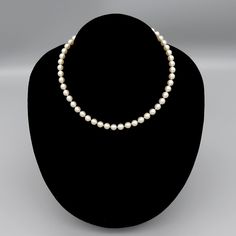 Presented is a vintage, pearl choker or collar style necklace with a 10 karat white gold clasp made in America during between 1960 to the 1980s. The necklace is individually knotted with pearls and the 10 karat gold clasp is done in a filligree form. The pearls measures approximately 6.8 millimeters in diameter. The clasp is marked 10K. Tested and guaranteed to be 10 karat gold purity. This piece is in great overall condition. The pearls have some natural blemishes. There are no missing pearls. Formal Vintage Akoya Pearl Necklace, Vintage Akoya Pearl Necklace For Formal Occasions, Vintage Single Strand Akoya Pearl Jewelry, Classic Formal Jewelry With Round Beads, Classic Single Strand Round Bead Jewelry, Adjustable Pearl Chain Necklace For Formal Occasions, Classic Single Strand Round Pearl Necklace, Classic Round Single Strand Jewelry, Classic Single Strand Round Jewelry