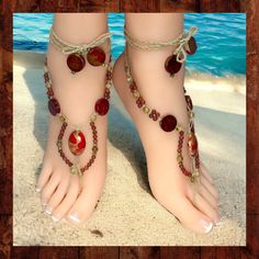 These handmade barefoot sandals are made from natural hemp knotted with red jasper and picture jasper gemstone beads and are accented with golden metal and large acrylic beads. The toe strap and ankle ties are braided for extra durability. These sandals have 16-inch long ties with beads at the ends. The ties wrap around the ankle and can be adjusted to fit all adult sizes. These woven barefoot sandals are one-of-a kind and the photos are of the exact item for sale.  They are designed to be adjus Adjustable Spiritual Anklets For Beach, Red Bohemian Jewelry For Vacation, Bohemian Red Jewelry For Vacation, Red Bohemian Jewelry For Beach, Bohemian Red Jewelry For Beach, Red Bohemian Jewelry For The Beach, Red Jewelry For Beach Festivals, Red Bohemian Beach Jewelry, Adjustable Beaded Barefoot Sandals For Beach