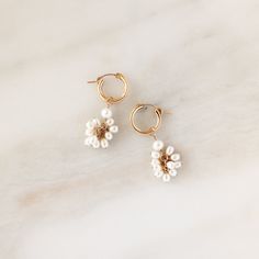 Inspired by the delicate charm of blossoming flowers, these iridescence hoops feature freshwater pearls individually hand wrapped and perfectly placed on to a pair of hoop earrings. Each piece is handcrafted to order, right here in our Salt Lake City studio by one of our skilled artisans. Make it a set with our matching Pearl Blossom Collection. DETAILS Available in sterling silver or 14k gold filled. Made with freshwater pearls. Want to mix + match charms? Or simply switch it up some days? Thes Delicate Dangle Hoop Earrings With Pearl Charm, Delicate Hoop Jewelry With Flower Charm, Delicate Pearl Earrings With Flower Charm, Delicate Hoop Earrings With Flower Charm, Delicate Dangle Pearl Hoop Earrings, Delicate Drop Flower Earrings With Pearl Charm, Delicate Hoop Earrings With Pearl Charm, Small Hoop 14k Gold-filled Pearl Earrings For Wedding, Small Hoop 14k Gold Filled Pearl Earrings For Wedding