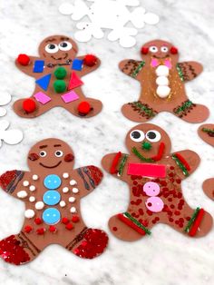 gingerbread cutouts are displayed on a marble surface