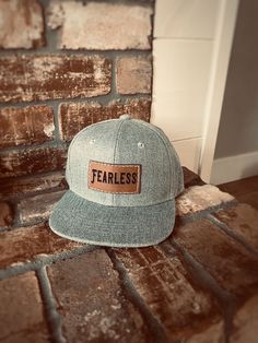 "FEARLESS kids baby/toddler and Kids size Snapback hat. Stylish, durable and high quality for your adventurous little one! Adjustable Snapback style so it will fit them as they grow. Available in Heather Gray, Black or Gray Camo. Features: * Adjustable Snapback style to grow with your child * Stylish and high quality * Faux leather patch * Hand sewn * Ready to ship! * Comfortable and breathable so your kids will love to wear them! Sizing: *On average our hats will fit the age ranges specified be Adjustable Flat Bill Baseball Cap, Adjustable Casual Snapback Hat With Leather Patch, Father's Day Casual Adjustable Snapback Hat, Casual Baseball Cap With Flat Crown, Casual Leather Patch Snapback Baseball Cap, Casual Hats With Leather Patch, Adjustable Trucker Baseball Cap With Letter Patch, Adjustable Flat Bill Snapback Hat For Father's Day, Casual Hats With Leather Patch And Curved Bill