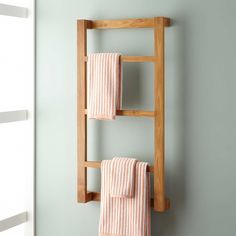 a towel rack with two towels hanging on it