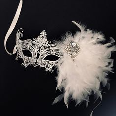 Dazzle and enchant with our women's white metal masquerade mask. The white feather clip adds a touch of playfulness and grace, swaying with your every movement. The sparkling rhinestones and brooch on the mask add a touch of glamour, reflecting your inner brilliance. From grand masquerade balls to themed soirées and enchanting celebrations, our Venetian-style mask will elevate your allure to celestial heights!


Age Group/Gender - Adult/Women

Size/Type - One size fits all adults

Mask Color - W Mascarade Ball Dresses, Wedding Masquerade, White Masquerade Mask, White Masquerade, Masquerade Mask Women, Elegant Face Mask, Mask Venetian, Masque Halloween, Metal Mask