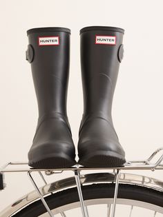 The Women's Original Short Rain Boot is a shorter version of the iconic Hunter Original Tall Boot and perfect for wet-weather conditions. Formed of natural rubber, each boot is handcrafted and assembled over three days before being vulcanised for superior protection. The Hunter Original tread pattern and comfortable 100% recycled polyester lining completes the design on this 100% waterproof boot. Weatherproof Outdoor Boots With Recycled Rubber, Weatherproof Recycled Rubber Boots For Outdoor, Outdoor Weatherproof Boots With Recycled Rubber, Weatherproof Recycled Rubber Outdoor Boots, Waterproof Recycled Rubber Boots For Outdoor, Waterproof Outdoor Boots In Recycled Rubber, Waterproof Boots Made Of Recycled Rubber For Outdoor, Waterproof Outdoor Boots Made Of Recycled Rubber, Outdoor Waterproof Boots Made Of Recycled Rubber