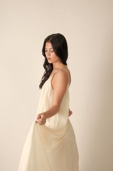 About Product Low-Back Tencel Cami Dress - This dress features a flattering low-back design that adds a touch of allure and sophistication.Made from eco-friendly and sustainable Tencel fabric, it offers a soft and smooth feel against your skin, ensuring both comfort and environmental responsibility. The breathable material makes it perfect for warm days and keeps you feeling fresh and stylish all day long.The cami-style bodice showcases your shoulders and neckline beautifully, while the low back Flowy Daywear Maxi Dress, Flowy Unlined Maxi Dress For Daywear, Flowy Maxi Dress With Spaghetti Straps For Daywear, Chic Rayon Loungewear Dress, Daywear Spaghetti Strap Dress With Smocked Back, Spring Silk Slip Dress With Built-in Bra, Flowy Spaghetti Strap Dress For Brunch, Midi Length Dress With Adjustable Straps For Daywear, Daytime Dresses With Adjustable Spaghetti Straps