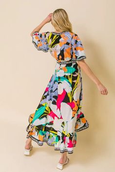 A printed midi dress featuring surplice neckline, fluttered sleeves, elasticised waist with self-sash tie and faux wrap with ruffled hemline Multicolor Fluttered sleeves Self sash tie Elasticized waist Surplice neckline 100% Rayon True to size Multicolor V-neck Floral Dress With Vibrant Print, Multicolor Print V-neck Midi Dress For Vacation, Multicolor Tropical Print Midi Dress For Summer, Multicolor Floral Midi Dress For Beach, Multicolor Floral Dress With Vibrant Print For Garden Party, Vibrant Multicolor Floral Dress For Garden Party, Printed Midi Dress For Brunch, Spring Vacation Printed Midi Dress, Summer Dresses With Vibrant Patterned Print