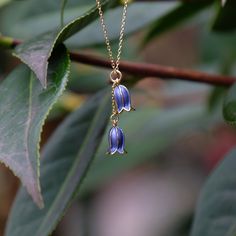 Our bluebell flower necklace adds elegance to any outfit and make a fabulous Christmas gift for a flower lover. Each necklace is hand finished in blue enamel. This beautiful necklace embodies nature with its intricate realistic design and attention to detail. Designed by us, in our London office. The Bluebell is a symbol of gratitude, humility and ever lasting love. It is also the flower to celebrate that Spring has arrived and the warmer Summer months will soon follow. Bluebells are the birth f Bluebell Necklace, Bluebell Flower, Blue Bell Flowers, London Office, Wire Flowers, White Jewelry Box, Fabulous Christmas, Pendant Necklace Gold, Lasting Love