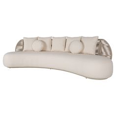 a white couch with four pillows on it