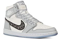 Dubbed “the most luxurious Air Jordan 1 ever”, all 8500 pairs of available Air Diors were made entirely in Italy with the finest materials and craftsmanship. The upper is constructed with white and Dior grey leather, where oblique monogrammed Swooshes enhances the opulent look. Underfoot, an translucent icy outsole completes the design. (AJ1/SNKR/Retro/Unisex/Basketball) Sepatu Air Jordan, Air Dior, Doudoune The North Face, Men Dior, Jordan 1 High Og, Air Jordan 1 Retro High, Nike Basketball Shoes, Nike Air Jordan 1, Jordan 13