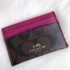 a coach card case sitting on top of a white furnishing surface with the name coach written on it