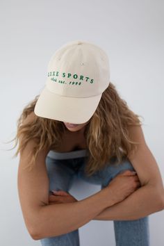 Designed for versatility, just like the Cara Loren brand, the Luxe Sports Cara ball cap is the Spring wardrobe staple you’ve been searching for. Whether you’re headed to a workout or brunch with friends, this classic ball cap with a curved brim is a timeless outfit completer. The Luxe Sports ball cap includes embroidered lettering for an elevated, true luxe finish. 100% cotton twill is the best combination of breathability + durability. An adjustable strap on the back makes this hat size customi Adjustable Sporty Snapback Hat With Curved Bill, Adjustable Curved Bill Snapback Hat For Sports, Classic Baseball Cap With Curved Visor For Sports Events, Classic Baseball Cap For Sports Events, Sporty Adjustable Snapback Hat With Curved Visor, Sporty Curved Bill Hat For Outdoor, Curved Brim Trucker Hat For Spring Sports, Spring Sports Trucker Hat With Curved Brim, Spring Sports Trucker Hat With Curved Bill