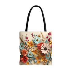 "Embrace the vibrant beauty of spring and summer with our Vibrant Multi-Color Flower Meadow Design Tote Bag. Adorned with a lively and colorful floral design, this tote captures the essence of a bright, blossoming garden. Delight in the visual bouquet of daisies, roses, and other botanicals in rich shades of pink, orange, yellow, and blue, set against a neutral backdrop. Each flower is intricately detailed with soft shading, offering a lively and realistic appearance that radiates the joyful exuberance of a garden in full bloom. Contrasting black handles not only enhance the tote's vibrant botanicals but also ensure a comfortable carry, making it the perfect accessory for anyone who loves to bring the joy of spring and summer wherever they go. Crafted from durable medium-weight polyester a Trendy Flower-shaped Shoulder Bag For Spring, Spring Travel Canvas Bag With Square Shape, Spring Travel Square Canvas Bag, Square Canvas Travel Bag For Spring, Spring Large Capacity Square Canvas Bag, Large Capacity Square Canvas Bag For Spring, Trendy Square Canvas Bag For Spring, Spring Vacation Canvas Bag With Adjustable Strap, Spring Canvas Shoulder Bag For Daily Use