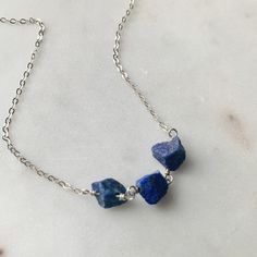 🎄🎁please order by December 12 for delivery by Christmas This raw Lapis Lazuli necklace is handmade with genuine rough nugget stone beads, .925 sterling silver chain, wire and clasp.  This necklace pictured is 16" length, but is available in 16", 18", 20" or 24" style. Beads measure 7-10 mm in size apiece. Each bead is hand picked during the crafting of each necklace so the size, shape and color will vary slightly in each stone.  Lapis is one of the semi-precious birthstones for September and i Sterling Silver Crystal Necklaces With Gemstone Beads, Sterling Silver Crystal Necklace With Gemstone Beads Gift, Sterling Silver Gemstone Bead Necklaces For Everyday, Sterling Silver Necklaces With Gemstone Beads For Everyday, Everyday Sterling Silver Necklaces With Gemstone Beads, Everyday Sterling Silver Crystal Necklace With Natural Stones, Minimalist Sterling Silver Crystal Necklace With Natural Stones, Minimalist Sterling Silver Necklace With Natural Stones, Nickel-free Lapis Lazuli Necklace Gift