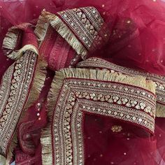 This gorgeous Bridal Queen Maroon Stone Embroidered Fringed Net Dupatta comes with a traditional and festive Maroon tone just like Katrina Bridal Dupatta. To enhance this, a detailed and fine thread and sequin border on silk with dainty fringes on the edges. Look like a queen wearing the Bridal Dupatta worn by Katrina at her wedding with this net stone work embroidered dupatta from anokherang. Material : Net Work type : Stone, Sequin Pattern Type : Embroidered with Fringes Color : Maroon Length Chunni Designs, Bridal Dupatta Designs, Duppattas Designs Ideas, Dupatta Design, Heavy Dupatta, Bridal Dupatta, Sequin Pattern, Indian Bride Outfits, Indian Dresses Traditional