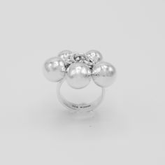 "DON 925's master silversmiths handcrafted with genuine sterling silver this statement ring that features a fun spheres design. Band width: 5 mm (0.20\") Approx. sphere size: 9 mm (0.35\") Weight: 10 grams (0.35 oz) Stamped with \"925\" the quality hallmark and place of origin \"Mexico\". Best way to keep your item shiny and clean is by leaving it on while you wash your hands with warm soapy water, dry ring thoroughly and gently. ★Premium DON925 bag included ★FAQs: https://www.etsy.com/shop/don9 Modern Handmade Sterling Silver Dome Ring, Modern Handmade Dome Ring In Sterling Silver, Modern Dome Ring Gift, Unique Sterling Silver Dome Ring, Silver Dome Ring With Polished Finish, Unique Silver Orb-shaped Jewelry, Modernist Sterling Silver Dome Ring As Gift, Modernist Silver Dome Ring For Gift, Modernist Silver Dome Ring As Gift