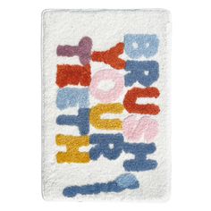 a towel with the words happy birthday written in multicolored letters on white background