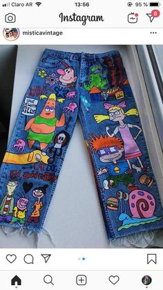 the jeans are decorated with cartoon characters on them