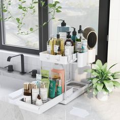 the bathroom sink is filled with personal care products and toiletries, along with a potted plant