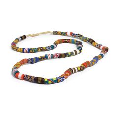 The Ghana Trade Bead Long Necklace is 43 inches long and is made with multicolored glass beads. The long design allows you to wear it in different styles. It's a colorful accessory that adds to any outfit. The beads are made in Ghana and show the skill of local craftspeople. This necklace can be worn hanging long or layered. Each bead is handcrafted, so no two necklaces are the same. Features: Crafted with vibrant colored glass trade beads. Generous 43" length for versatile styling. Lightweight Krobo Beads, African Trade Beads, Decorative Beads, Colorful Accessories, Unisex Necklace, African Jewelry, Trade Beads, Bead Stringing, Ethnic Jewelry