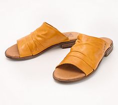 If the phrase goes with everything appeals to you, snatch up these gorgeous European leather slide sandals. Crafted with a walk-anywhere heel and luxe, low-key vibe, they're just as comfy kicking back in shorts and a tee as they are mingling in your garden party dress. From Miz Mooz. Summer Slip-on Mules With Leather Sole, Summer Closed Toe Mules With Rubber Sole, Summer Leather Footbed Slip-on Slides, Summer Mules With Rubber Sole And Round Toe, Chic Slip-on Slippers For Summer, Summer Leather Footbed Slippers With Round Toe, Summer Slippers With Leather Footbed And Round Toe, Vacation Mules With Leather Footbed And Open Toe, Summer Slip-on Open Toe Slippers