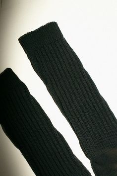 Solid Stretch Knee-high Socks, Solid Color Stretch Knee-high Socks, Black Stretch Cotton Knee-high Socks, Trendy Black Cotton Leg Warmers, Solid Cotton Leg Warmers For Fall, Black Cotton Knee-high Socks For Fall, Black Cotton Knee-high Leg Warmers, Classic Solid Winter Socks, Classic Winter Socks