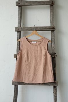 Sleeveless shirt is made from 100% soft and washed linen. Details: - Colour: Dusty rose - Composition: 100% Oeko-Tex certified linen - A line style - Medium weight linen - Linen care: machine wash gentle; tumble dry low, ironing optional - The price is for one shirt, other pictured items are not included Everyday Linen Sleeveless Tank Top, Everyday Sleeveless Linen Tank Top, Casual Sleeveless Flax Tank Top, Beige Sleeveless Linen Top, Flax Sleeveless Top For Spring, Sleeveless Flax Tops For Spring, Spring Flax Sleeveless Top, Spring Sleeveless Flax Tops, Everyday Linen Tank Top