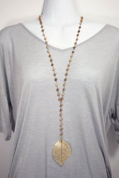 This lariat style necklace is perfect for the fall season. Easy to wear even over a sweater and no clasp to fiddle with. The top of the necklace measures 30 inches and the bottom portion is 6 inches. Each bead is wired with antique gold colored wire by hand, ending in a  highly detailed 14k gold dipped leaf. Bohemian Lariat Necklace With Beaded Chain, Bohemian Beaded Lariat Necklace, Brown Lariat Necklace With Adjustable Length, Bohemian Brown Beaded Lariat Necklace, Bohemian Lariat Single Strand Long Necklace, Handmade Brown Lariat Necklace, Gold Bohemian Lariat Necklace With Natural Stones, Handmade Bohemian Jewelry For Fall, Handmade Adjustable Jewelry For Fall