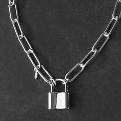 This classic Sterling Silver Padlock and Paperclip Chain Necklace has been crafted from high quality Italian sterling silver that will last a lifetime. Featuring a padlock pendant as the clasp, it's the perfect statement necklace for any look. Details: Chain: Solid Italian Sterling Silver Paperclip chain, 6mm Clasp: Sterling Silver working padlock clasp, 20x15mm Sizes: 16 inches to 36 inches Shipping: Ready to ship within one business day Complimentary shipping in the USA Complimentary gift wrap Silver Paperclip Necklace, Paperclip Chain Necklace, Padlock Necklace, Personalized Pendant, Chain Necklaces, Paper Clip, Cable Chain, Solid 925 Sterling Silver, Chain Link