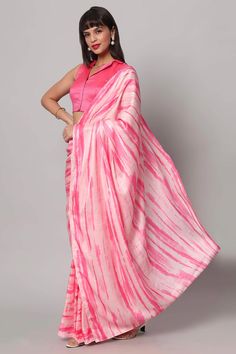 This lightweight Pink Tie-Dye saree is a versatile saree that is a must have in your wardrobe. This saree drapes like a dream will give you great and can be work for any event from beach party to wedding party! About this Product Saree: Saree Color: Pink & White tie-dye Saree Fabric: Satin Type of Work: Tie Dye Print Trim: N/A Drape Style: Choose the drape style while order: Standard Open, Pleated or Gujarati Saree length: 5.5 meters Petticoat: Saree comes with an in-built butter crepe petticoat Summer Unstitched Chanderi Saree, Unstitched Chanderi Saree For Summer, Summer Chanderi Saree, Summer Chanderi Saree With Unstitched Blouse, Summer Chanderi Saree With Pallu, Summer Saree With Sheer Dupatta Fabric Only, Unstitched Summer Saree With Sheer Dupatta, Summer Semi-stitched Saree With Pallu, Summer Semi-stitched Saree With Sheer Dupatta