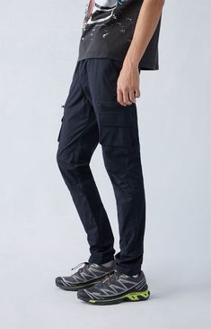 Casual meets cool with the new Stretch Black Slim Cargo Pants from PacSun. This go-to pair is designed with an elastic stretch waistline, adjustable drawstrings, side pockets, zip cargo pockets, a drawcord hem, and a slim fit.

Learn more about PacSun eco items Techwear Cargo Bottoms For Hiking, Straight Leg Cargo Pants With Elastic Waistband For Outdoor, Relaxed Fit Cargo Bottoms For Hiking, Hiking Bottoms With Side Pockets, Techwear Stretch Cargo Pants For Outdoor Activities, Stretch Techwear Cargo Pants For Outdoor Activities, Relaxed Fit Cargo Pants With Multiple Pockets For Hiking, Black Cargo Hiking Bottoms, Black Cargo Style Hiking Bottoms