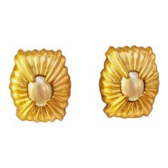 This is part of Chairish's Costume Jewelry Collection.  1970s Givenchy stunning vintage matte gold carved glass pearl  clip back earrings earrings  Signed, "Givenchy, Paris, new York"  From my private  secure collection, never worn. This pair of earrings make a statement  and are truly Stunning! 1970s Jewelry, Givenchy Jewelry, Givenchy Paris, Matte Gold, Costume Jewelry, Statement Earrings, Givenchy, 1970s, Jewelry Collection