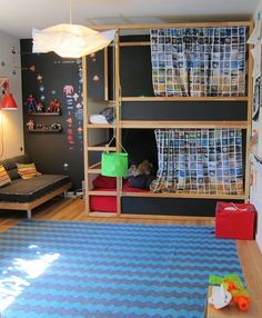 a child's bedroom with bunk beds and toys