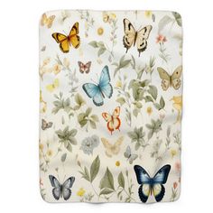 a blanket with butterflies on it and flowers in the foreground, against a white background