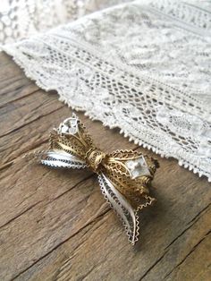 "Delicate antique 800 silver, two tone gold washed and bright silver filigree bow brooch. Highly detailed, three dimensional, very good condition, no broken or missing pieces, safety c pin back works well, holds securely. Measures 1 3/4\" x 7/8\". **Shipping includes insurance, when available**" White Filigree Brooches For Wedding, White Filigree Wedding Brooches, Silver Bow Brooch For Wedding, Victorian Filigree Brooches For Vintage Events, Victorian White Brooch For Anniversary, Antique White Brooches For Wedding, Vintage Wedding Brooches With Bow, Victorian White Wedding Brooches, Vintage Wedding Brooches With Bow Detail