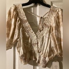 Size Large Secret Charm Ladies Blouse From Dillards New Never Worn, Excellent Condition. Open Back With Slightly Puffed Sleeves In Light Crme And Tan. Good For A Day Or Night Out To Be Paired With A Cute Skirt Or Pants! Cream Puff Sleeve Blouse For Summer, Casual Beige Peasant Top For Day Out, Summer Bohemian Blouse In Neutral Color, Neutral Bohemian Blouse For Summer, Summer Bohemian Neutral Blouse, Beige Peasant Top For Summer Day Out, Casual Flowy Beige Peasant Top, Fitted Beige Peasant Top For Summer, Casual Beige Flowy Peasant Top