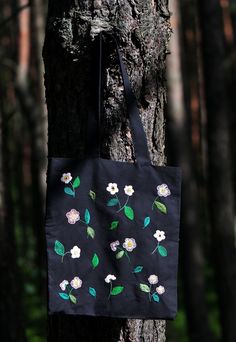 This is an original hand-embroidered 100 % cotton shopping bag with pink wild flowers' pattern. It does have a cotton lining too. The pattern is just on the one side of the bag. Measurements: 38 x 35 cm I heartily recommend buying this craft :) Black Embroidered Cotton Shoulder Bag, Embroidered Cotton Canvas Bag For Daily Use, Embroidered Cotton Eco-friendly Bags, Eco-friendly Embroidered Cotton Bags, Daily Use Embroidered Cotton Canvas Bag, Spring Black Cotton Shoulder Bag, Summer Embroidered Cotton Canvas Bag, Floral Embroidery Cotton Canvas Tote Bag, Cotton Bags With Multicolor Embroidery