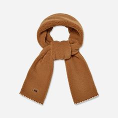 With a contrasting scallop trim, the UGG®fluff Scalloped Scarf puts a new twist on a classic winter accessory. | Plush fleece scarf. Self - 100% Polyester. Lining - Unlined. Features a scalloped trim on edge. 78 inch L X 7 inch W. Leather label with Graphic UGG® Font. Imported. | UGG® Women's UGG®fluff Scalloped Scarf Fleece Scarves in Chestnut Fleece Scarves, Fleece Scarf, Scallop Trim, Scarf For Women, Leather Label, Scalloped Trim, Cold Weather Accessories, Winter Accessories, Womens Uggs