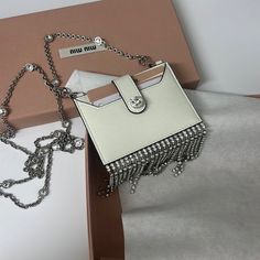 Small Wallet On Chain Chic White Wallet On Chain For Everyday, Elegant White Crossbody Wallet On Chain, White Rectangular Wallet On Chain For Evening, Elegant Miu Miu Shoulder Bag For Evening, Designer White Evening Bag As Gift, Designer White Evening Bag For Gift, Elegant White Rectangular Wallet On Chain, Luxury White Rectangular Wallet On Chain, Luxury White Clutch With Chain Strap