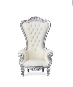 an ornate white chair with silver trimmings on the arm and back, sitting in front of a white background