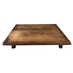 an old wooden table with metal legs