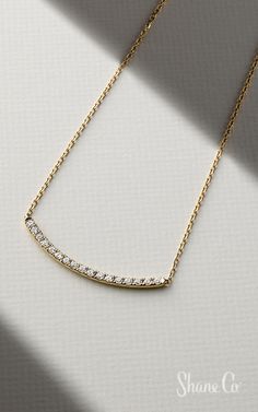 Add some sparkle to your outfit. Seventeen brilliant round diamonds line this on-trend curved bar necklace crafted from quality 14k yellow gold. The piece hangs from a matching 18″ cable chain with a 2″ extender chain. The bar measures 1 1/4″ in length. Article number: 41080902 Bar Necklace With Diamonds, Classic Everyday Diamond Necklace With Adjustable Chain, Elegant 14k Gold Bar Necklace With Cable Chain, Elegant Bar Necklace With Cable Chain, Elegant Bar Necklace With Adjustable Chain For Everyday, Everyday Yellow Gold Diamond Bar Necklace, Elegant Everyday Bar Necklace With Cable Chain, Everyday Diamond Necklace With Adjustable Chain, Elegant Everyday Bar Necklace With Adjustable Chain