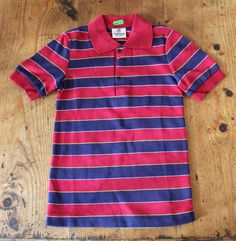 "FRENCH VINTAGE 70's, stunning striped polo top, cotton knit, navy blue and red colors, metallic snap buttons. Brand \" Fracasse \". Size 8 years New old stock I always refund overcharged shipping from 1 Euros overpaid ! Thank you for your visit" Fitted Polo Shirt With Buttons For Spring, Striped Cotton Polo Shirt For Spring, Spring Striped Cotton Polo Shirt, Fitted Polo Collar Top With Buttons, Fitted Tops With Polo Collar And Buttons, Spring Cotton Polo Shirt With Contrast Stripes, Retro Fitted Polo Shirt, Summer Fitted Polo Shirt With Striped Collar, Fitted Summer Polo Shirt With Striped Collar