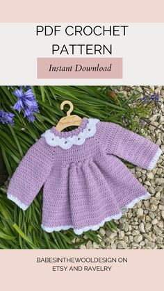 a crocheted baby dress with a wooden hanger on the front and bottom