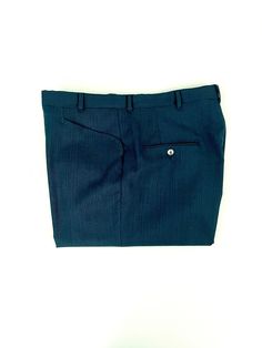 "Vintage Men's 70's Teal, Black, Wool Blend, Relaxed Fit, Cuffed Pants (W34) These 1970's Men's Pants come in a teal and black wool blend fabric with two front pockets, two back pockets and have a nylon zipper fly with a relaxed fit leg with a cuffed bottom hem. The pants are medium weight and have a slight stretch. Wool Blend No interior labels *These pants are in excellent condition. *If shipped within the US, they will ship Priority Mail for a quick delivery! Size: (34\" x 28 1/2\") Waist: 34 Tailored Blue Wool Bottoms, Tailored Wool Blue Bottoms, Retro Fitted Wool Bottoms, Blue Wool Bottoms With Welt Pockets, Fitted Blue Wool Bottoms, Vintage Wool Pants For Formal Occasions, Fitted Wool Blue Bottoms, Fitted Vintage Wool Pants, Retro Fitted Bottoms With Welt Pockets